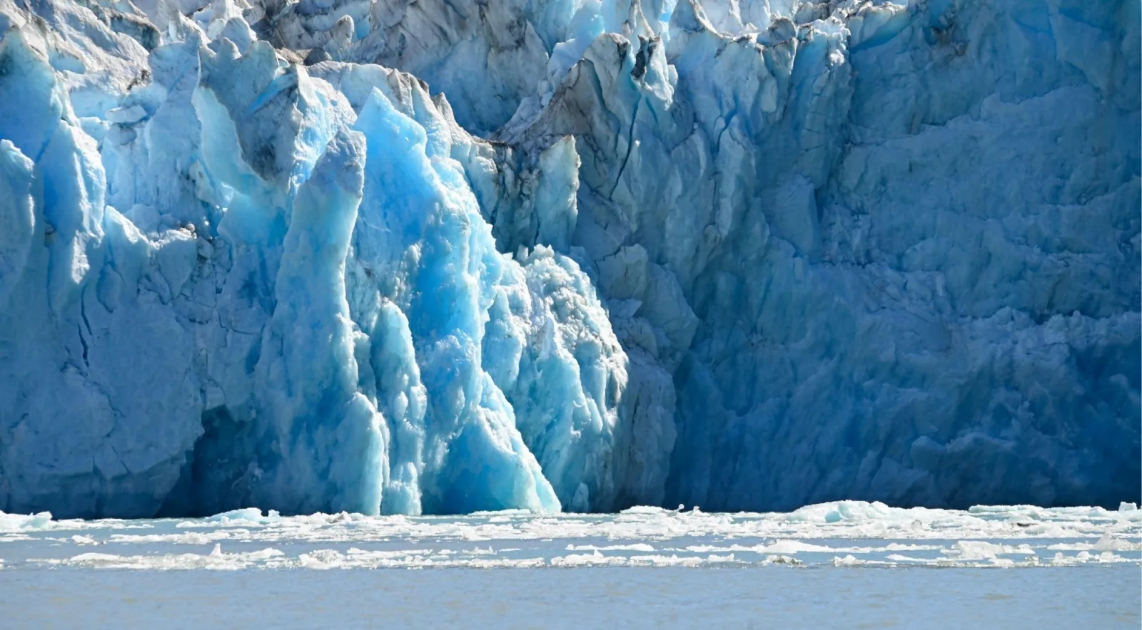 Towering blue seracs along the calving front of a tidewater glacier